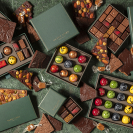 A variety of food packaging designs in various shapes, sizes, and colors displayed on identical squares with a white background.