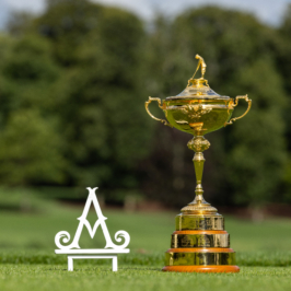 A luxurious estate with manicured gardens, tall trees, and a grand Gothic-style mansion. A serene, blue sky enhances the elegant, picturesque landscape.