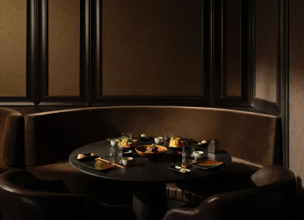 Interior of Oku Restaurant, featuring modern design with elegant lighting, wooden accents, and stylish dining tables set for a luxurious dining experience at Adare Manor.
